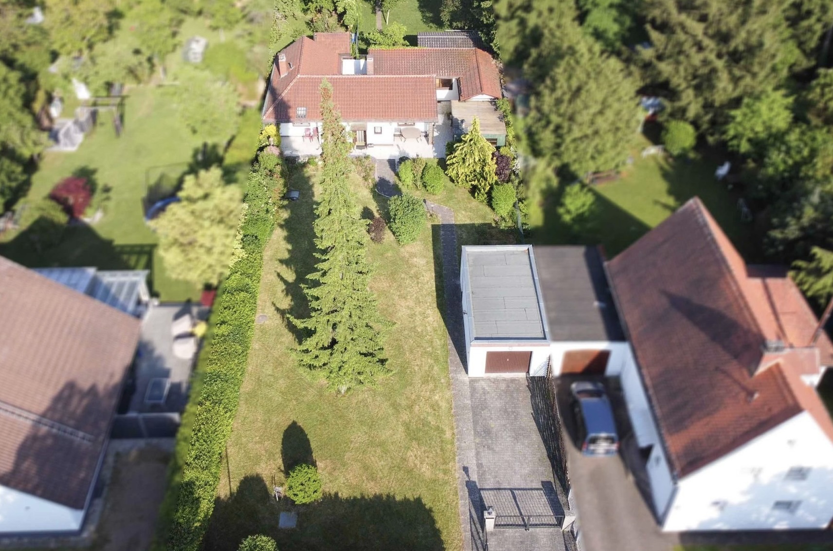 Hirschberg-Immobilien-Baugrundstück-mit-Altbestand-München-Berg-am-Laim-Drohnenaufnahme1-Beitragsbild